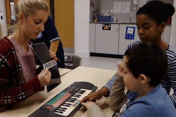 teaching autistic child to play keyboard using colour keys